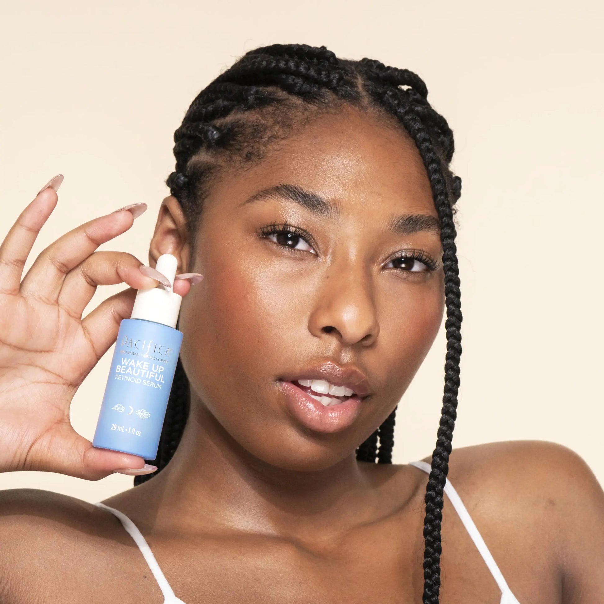 Black Woman Holding a Pacifica Beauty Wake Up Beautiful Overnight Retinoid Serum, Skincare, Reduce Fine Lines, Wrinkles, Dark Spots, and Uneven Skin Tone, Face Care, For Aging and All Skin Types, Vegan, 1 fl oz (1 Count) 1 Fl Oz (Pack of 1) - DivineLuxes