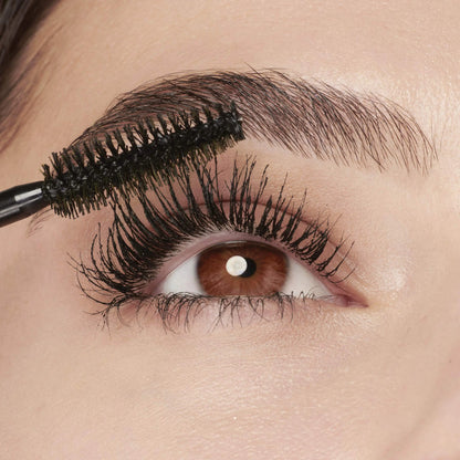 Eyelashes with Before and After Maybelline Volum' Express Colossal Washable Mascara Makeup, Classic Black Mascara, 1 Count WASHABLE CLASSIC BLACK 0.31 Fl Oz (Pack of 1) applied to the eyelashes
