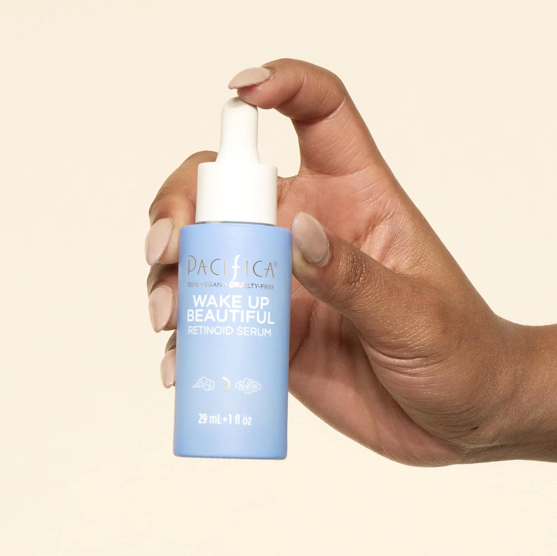 Holding a Pacifica Wake Up Beautiful Retinoid Serum